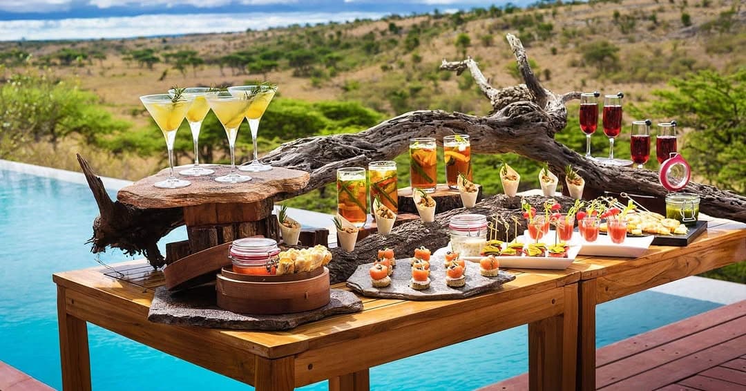 Sundowner drinks at Mahali Mzuri luxury tented camp, Masai Mara